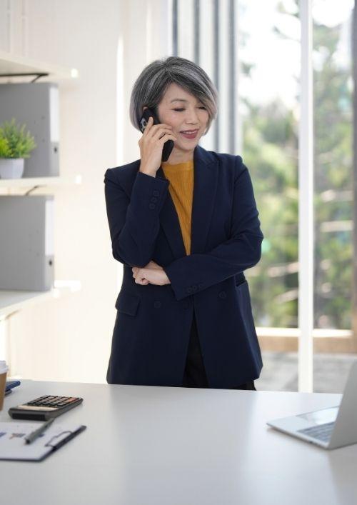 Confident, experienced manager working at a desk, representing the most secure careers in job security study.
